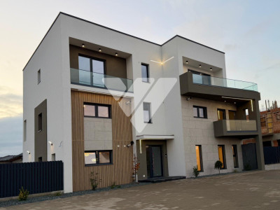 Apartament de lux 115 mp utili 4 camere 4 bai curte privata 200 mp